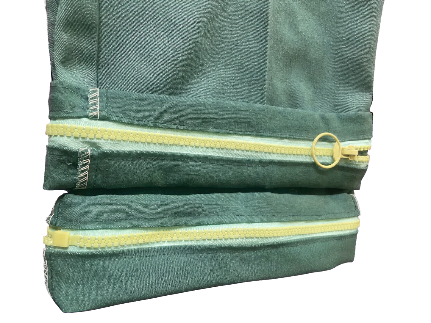 Close view of the neon yellow cuff zippers on Cuffed King